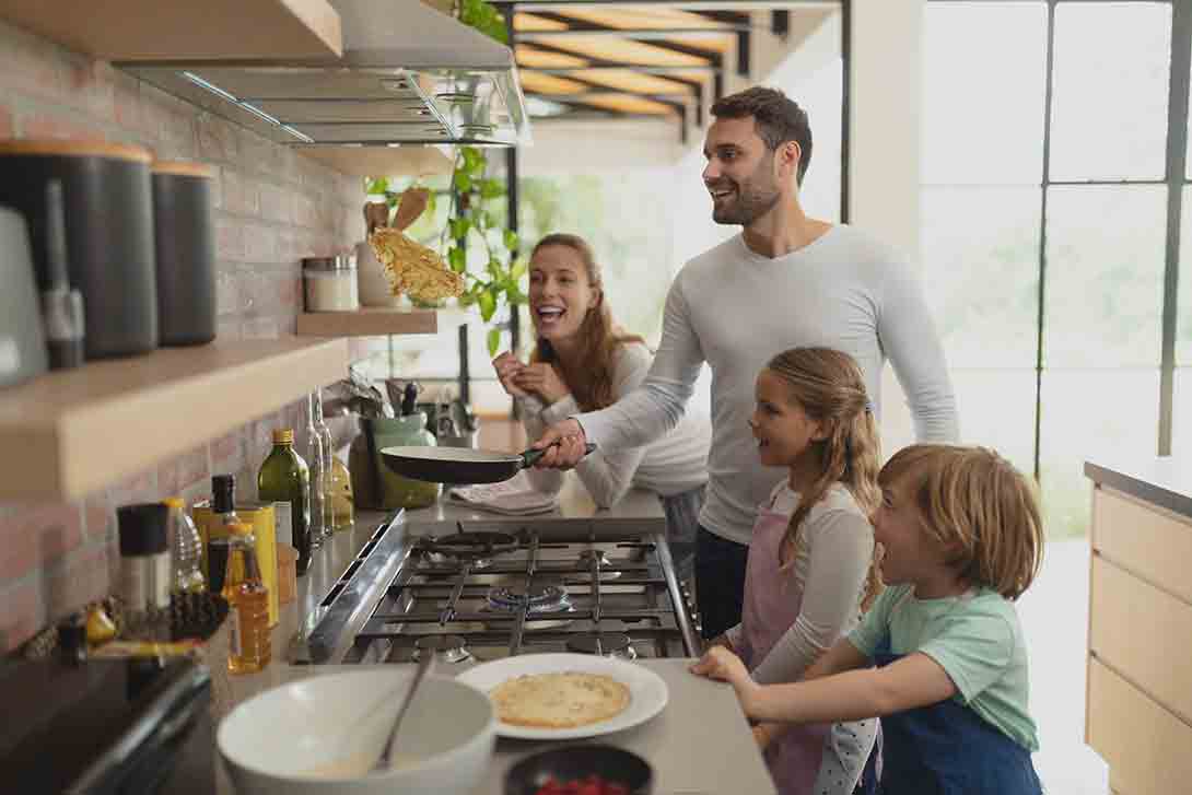 Propane versus natural gas Family cooking in kitchen