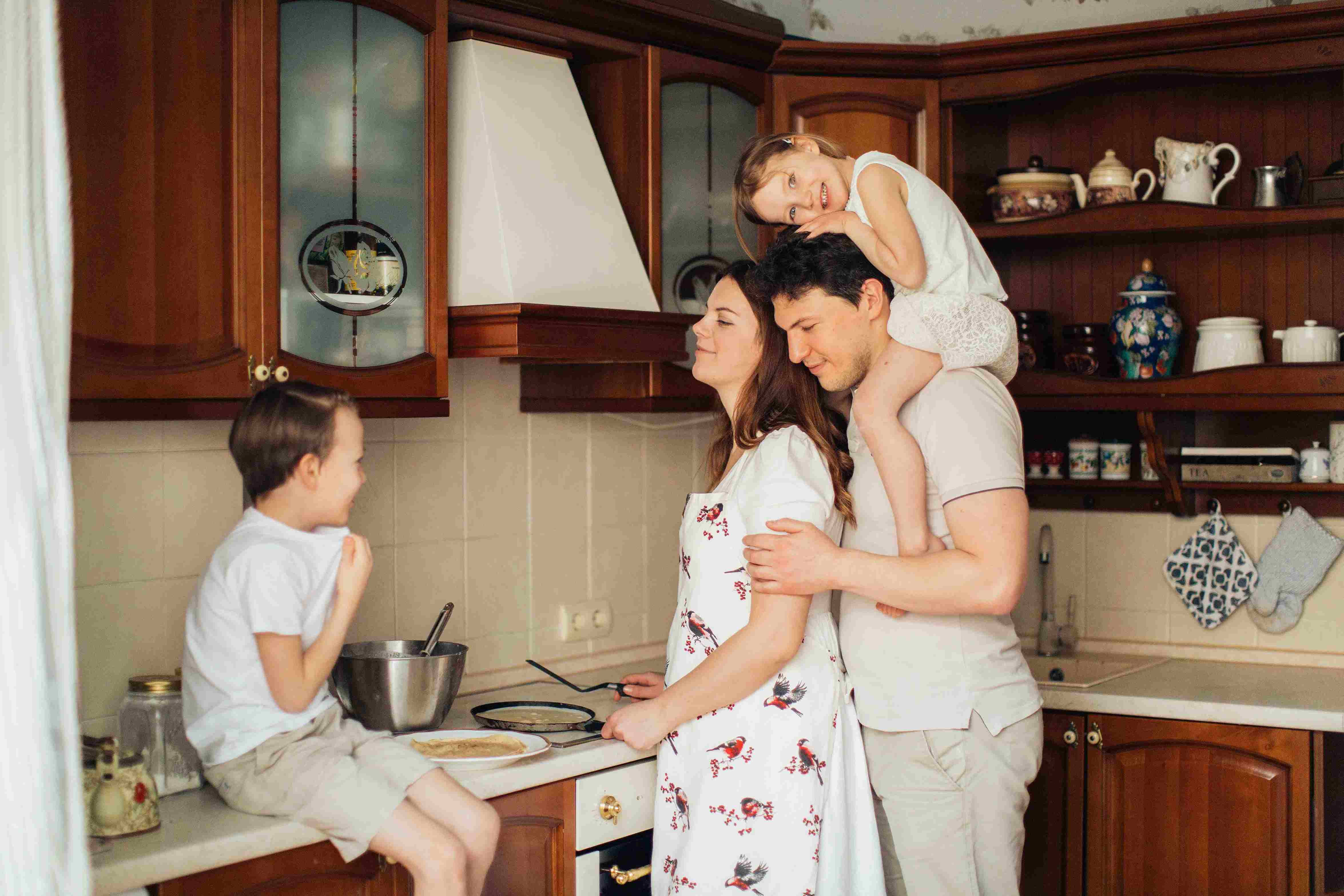 family in kitchen with baby